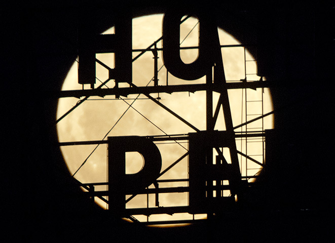 Supermoon: A full moon rises above Hotel Pere Marquette, in Peoria, Illinois