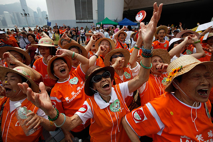 Supermoon: People practice Laughter Yoga in Hong Kong