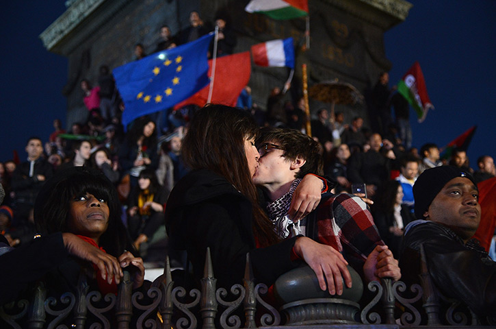 24 hours in pictures: Couple kiss at Place de la Bastille during French Presidential Elections