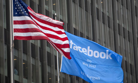 Facebook flag next to US flag outside the offices of J.P. Morgan in New York City