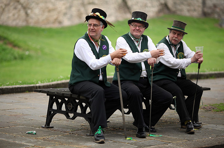chimney festival: A trio of Morris dancers have quick drink and a sit down