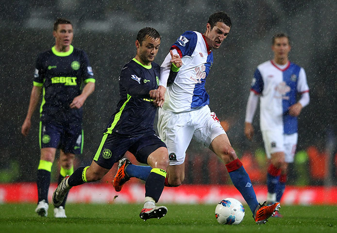 wigan v blackburn: Shaun Maloney of Wigan Athletic competes with Radosav Petrovic