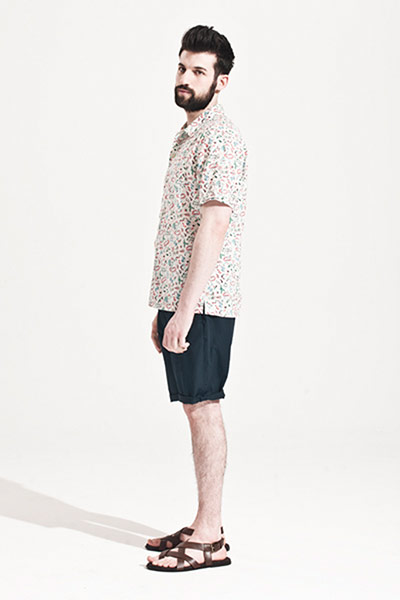 All Ages: Jose wears a flowery patterend shirt, navy shorts and brown leather sandals