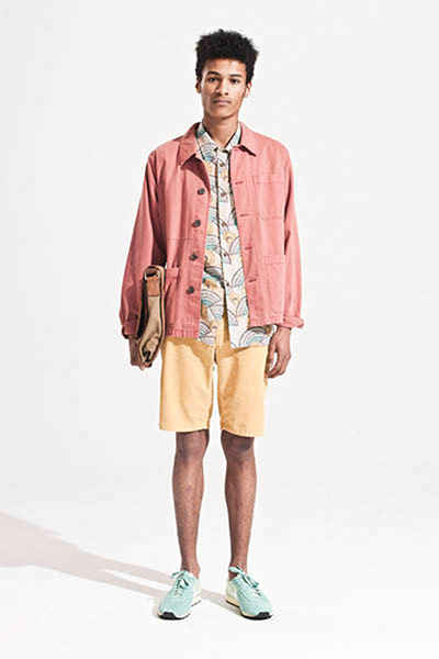 All Ages: Kumi wears patterend shirt, coral jacket and yellow shorts