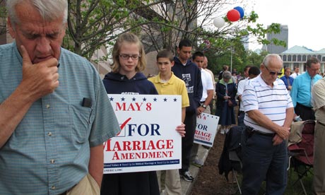 People pray supporting a constitutional ban on gay marriage in Raleigh, North Carolina