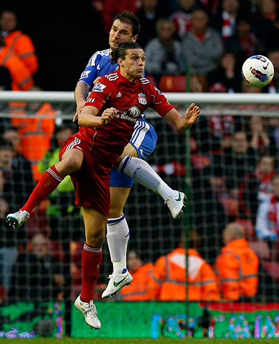 Liverpool v Chelsea: Chelsea's Branislav Ivanovic challenges Liverpool's Andy Carroll
