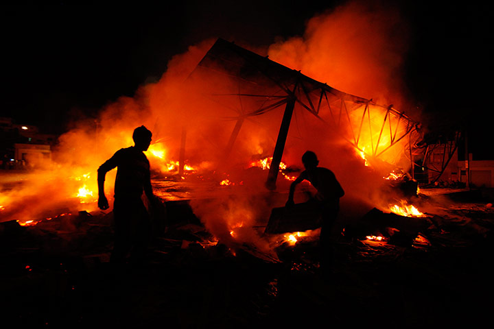 24 hours in pictures: A fire  at a wholesale fruit market in India