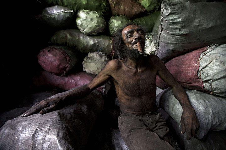 24 hours in pictures: Coal worker takes a break