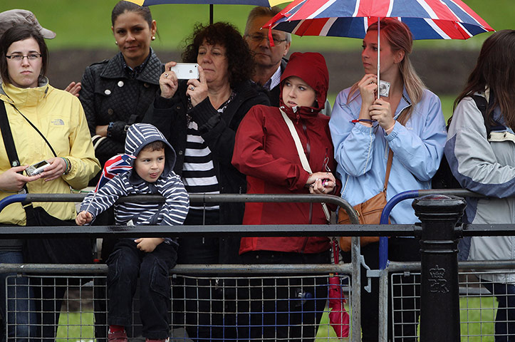 State Opening: Members of the public try to see the Queen
