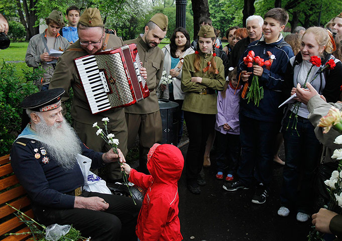 Victory Day in Russia: WWII veteran Fyodor Bortsov, 86, is offered a bunch of flowers