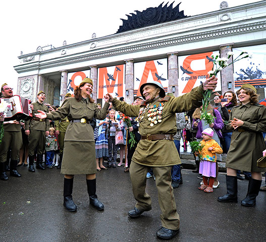Victory Day in Russia: Wearing a WWII Red Army uniform with medals, a veteran dances
