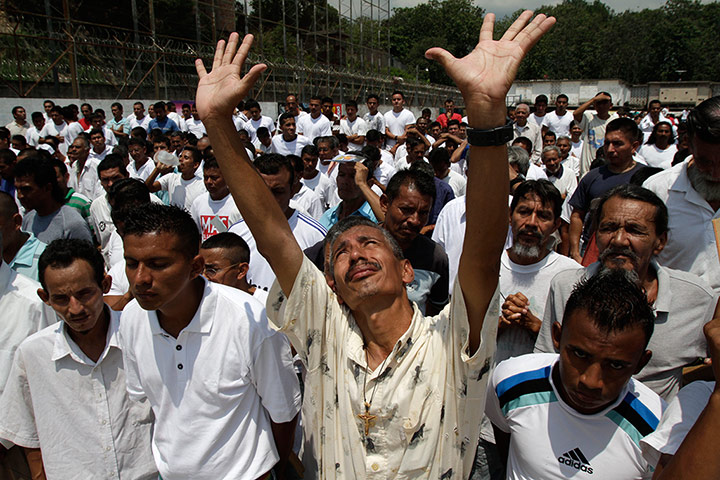 Longer View: Prison inmates pray in the courtyard