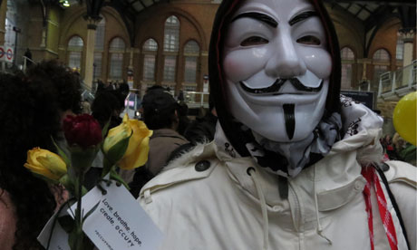 Occupy London celebrate May Day by handing out flowers in Liverpool St