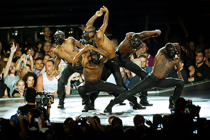 Madonna: Dancers wearing gas masks perform while Madonna has a break