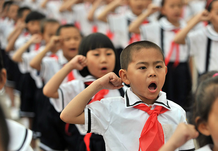 Picture desk live: Children attend a ceremony for Young Pioneers in Beijing