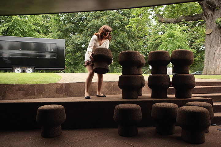 24 hours in pictures: Indian mahout Sambu swings from an iron scaffolding