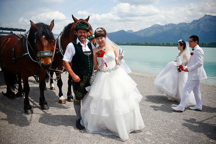24 hours in pictures: Chinese bridal couples pose after their symbolic wedding in Fuessen