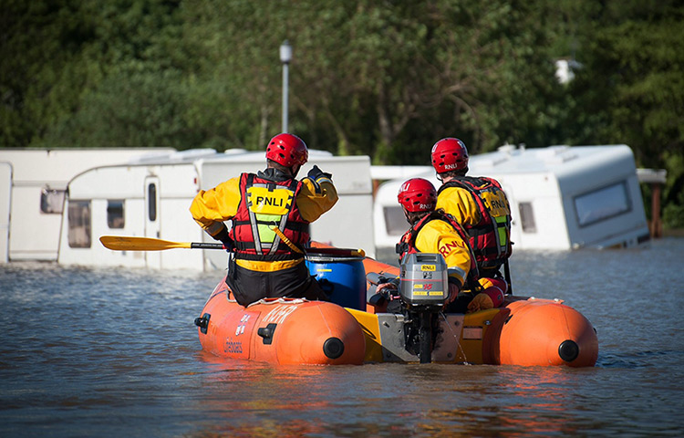 Wales floods: A RNLI flood rescue team conducts a search in Aberystwyth