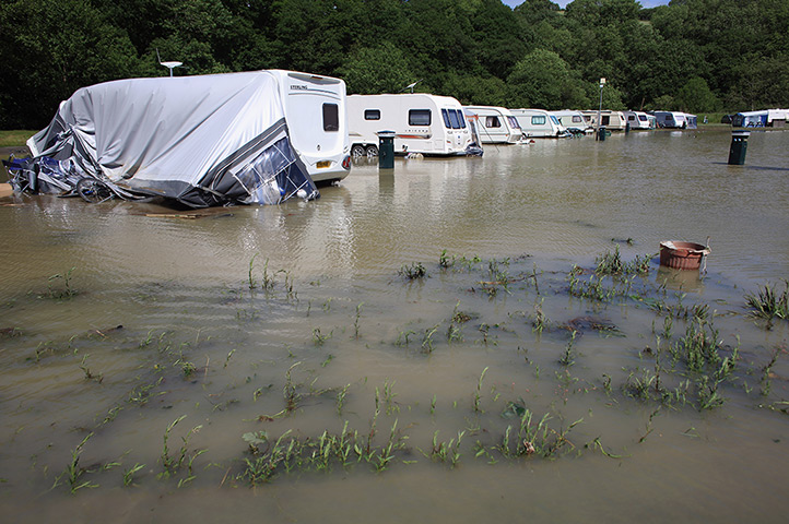 Wales floods: Caravans are damaged by flash floods near the village of Talybont 