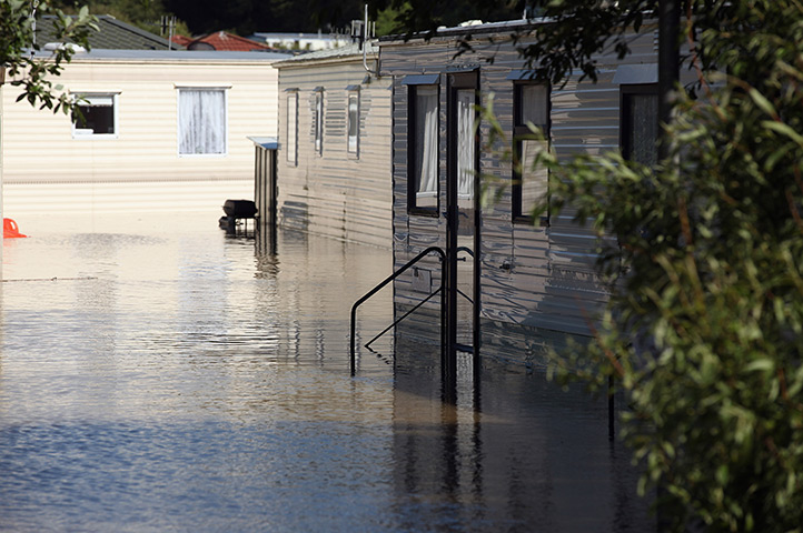 Wales floods: A caravan site is flooded in the seaside village of Borth 
