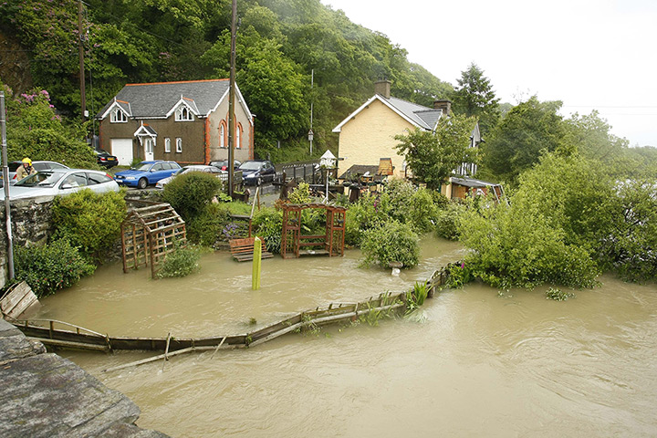 Wales floods: Flooded gardens of residential properties in Machynlleth