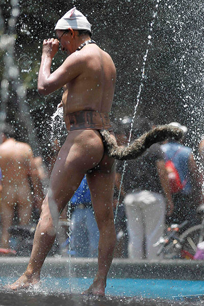 Nude Cyclists: Mexico City, Mexico: A naked cyclist wears a fake tail 