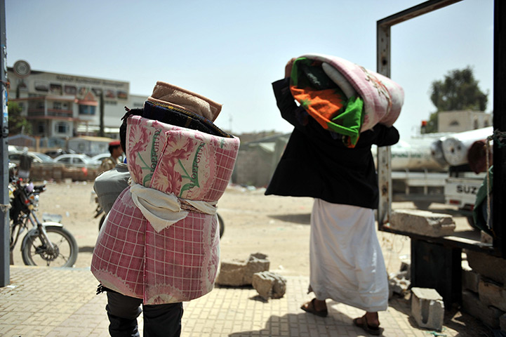 24 hours: Sana'a, Yemen: Yemeni protesters carry mattresses and blankets