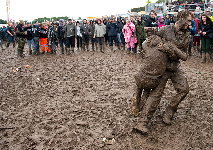 Download Festival: Festival goers fight in the mud during day 1