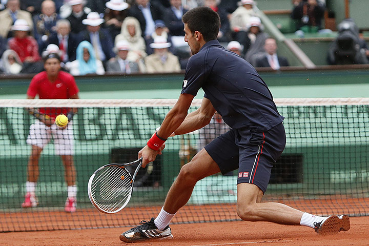 tennis: Serbia's Novak Djokovic hits a return to
