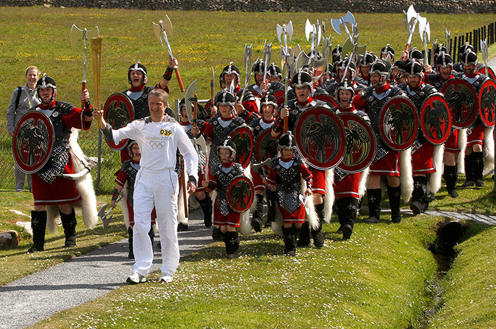 Picture Desk Live: The Olympic Torch Continues Its Journey Around The UK - Day 23