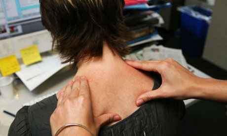 Woman gets massge at desk