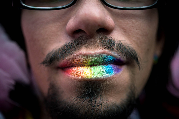 24 hours: São Paulo, Brazil: An attendee poses during the annual gay pride parade