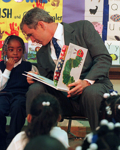 politicians in school: George Bush at the Henry Paidcia Elementary School 