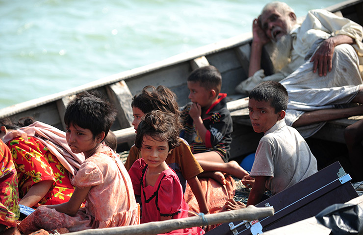 Myanmar violence: Rohingya children try to cross the Naf river in Teknaf by boat