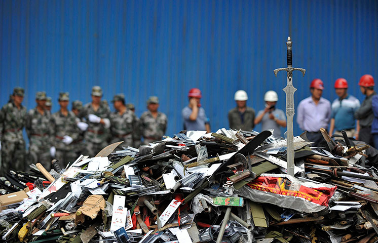 Picture desk live: Confiscated illegal weapons are collected to be destroyed in Kunming, China