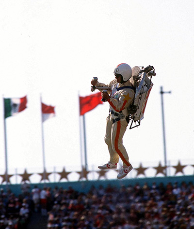 Olympic games opening: Los Angeles 1984: Space-age arrival for Bill Scooter using a jet pack