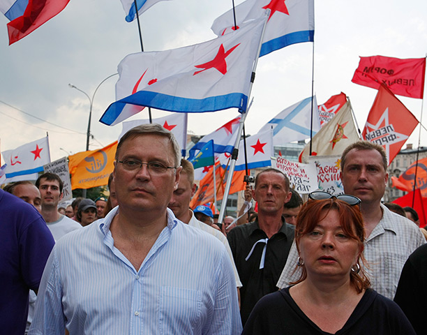 Moscow protests: Mikhail Kasyanov, left, and his wife Irina walk march 