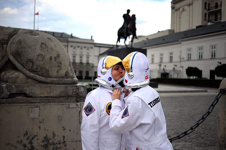 Picture desk live: A Russian couple dressed as astronauts in Warsaw for Euro 2012
