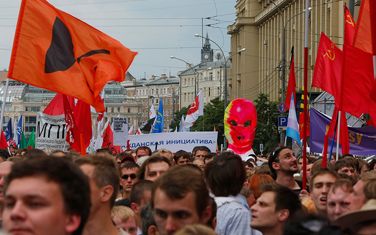Moscow protests: Opposition supporters march during a massive rally 