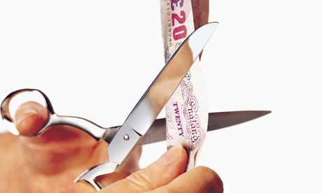 £20 note being cut by scissors