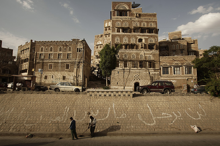 24 hours: Sana'a, Yemen: Street cleaners work in the old city
