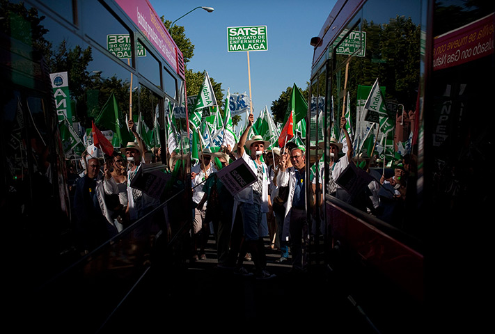 24 hours: Seville, Spain: Public sector workers take part in a demonstration 