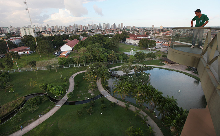 Amazon deforestation : A man looks down on an ecological park showcasing Amazonian foliage, Belem