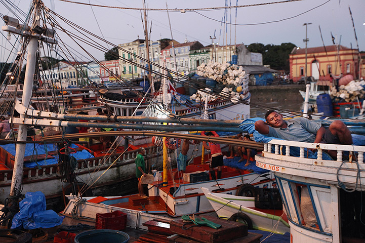Amazon deforestation : A fisherman rests on his boat docked at the historic Ver-el-Pes
