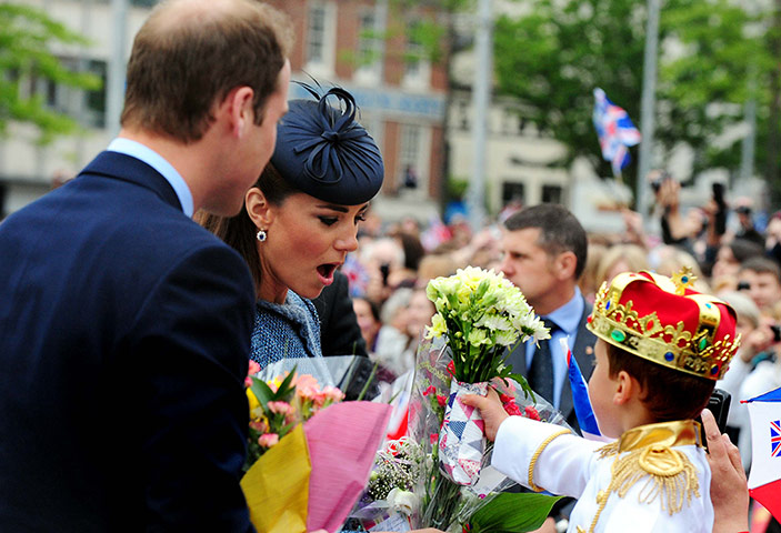Picture desk live: Little Brendon Morris captures Catherine's attention with flowers
