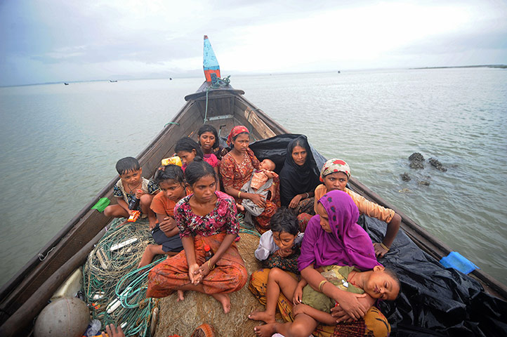 Picture desk live: Refugees try to cross into Bangladesh fleeing sectarian violence in Burma. 