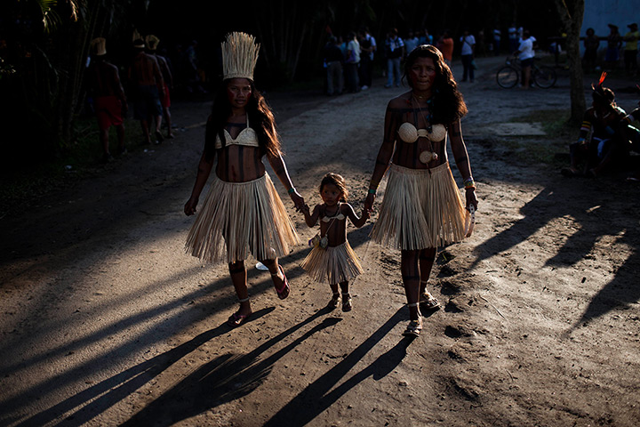 24 hours in pictures: Members of the Xerente tribe walk at the Kari-Oca village