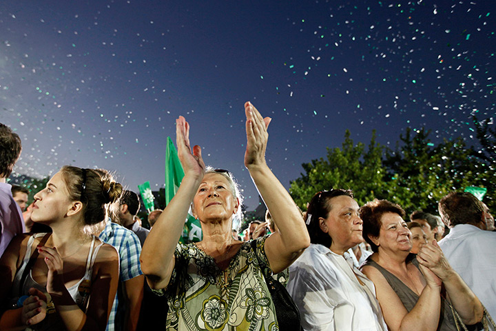 24 hours in pictures: Supporters of the Socialist PASOK party leader Evangelos Venizelos cheer