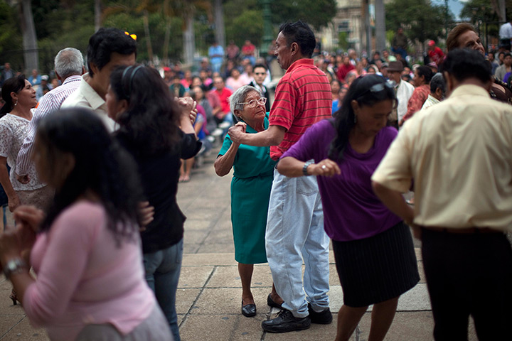 24 hours in pictures: People dance at a public park in Guatemala City