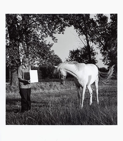 Invisible Art: A black and white image of man with horse
